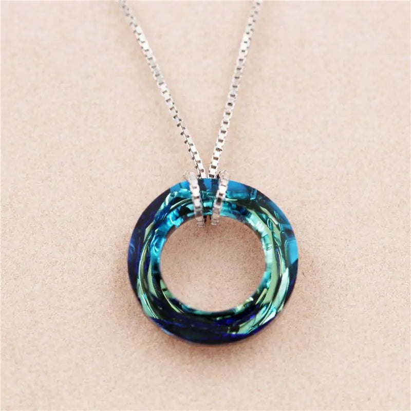 Captivating Oceanic Design  Embrace the Captivating Oceanic Design of the Ocean Spirit Pendant Necklace. This necklace features a beautifully crafted pendant inspired by the sea, capturing the essence of ocean waves and marine life.  Elegant and Timeless