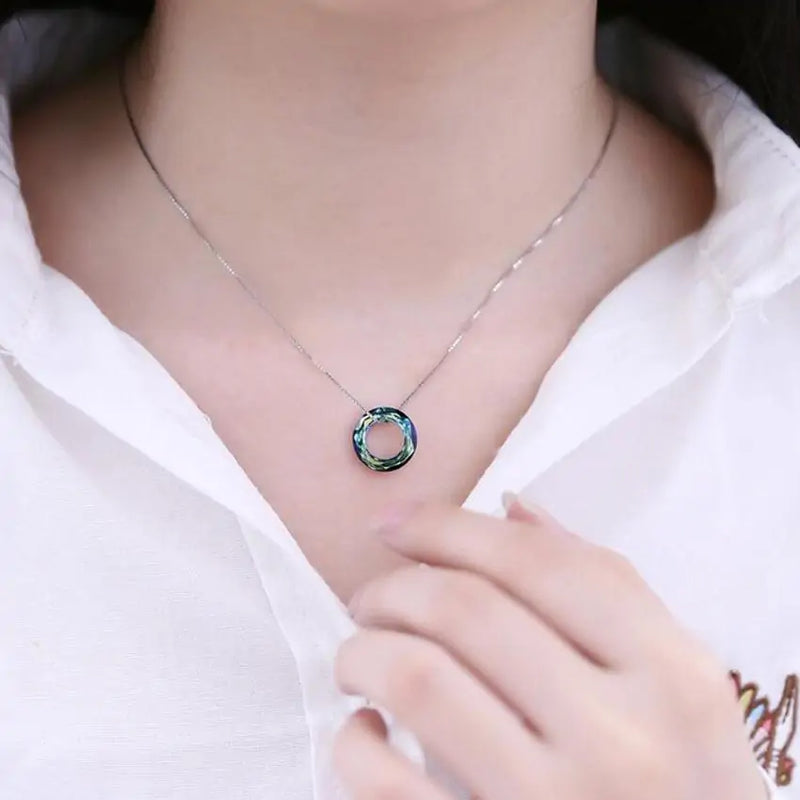 Captivating Oceanic Design  Embrace the Captivating Oceanic Design of the Ocean Spirit Pendant Necklace. This necklace features a beautifully crafted pendant inspired by the sea, capturing the essence of ocean waves and marine life.  Elegant and Timeless